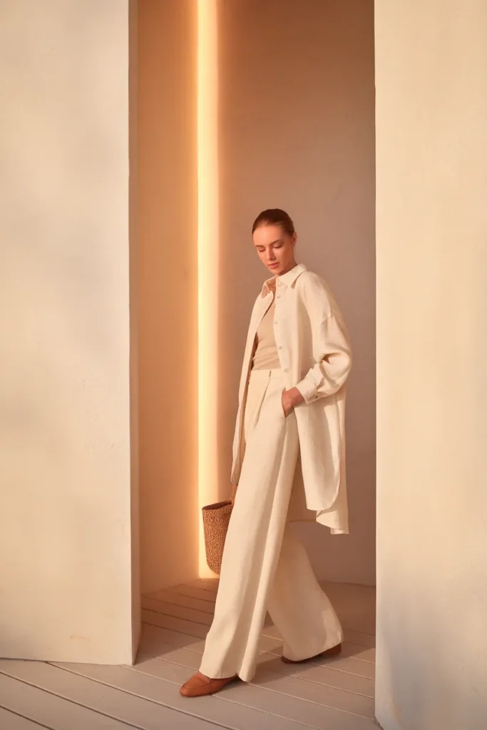 Head-to-toe tonal cream outfit with an oversized linen shirt for a long, elongating line.