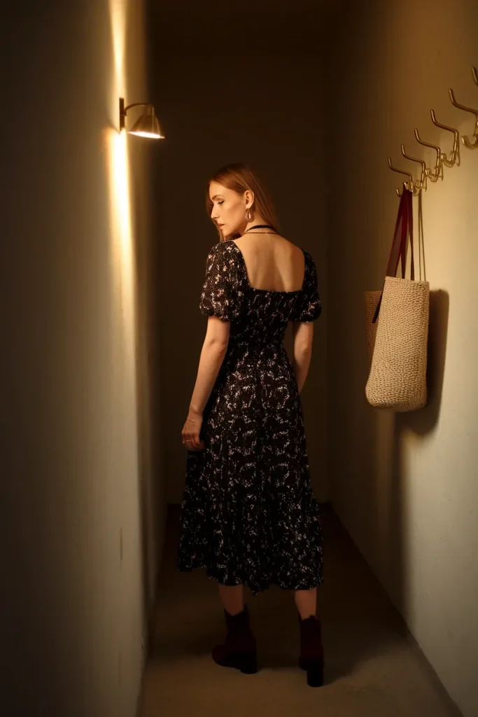 Black small scale floral midi dress with a thin gold choker showing restrained whimsigoth styling