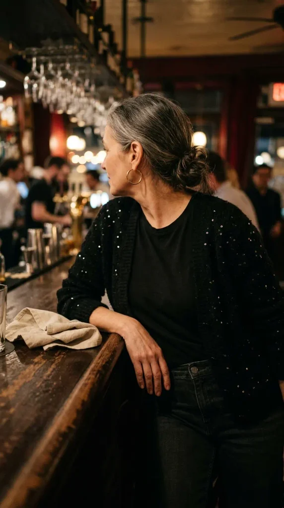 Sequin cardigan over a black tee and dark jeans, a sparkly Valentine's outfit for women over 50
